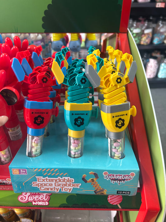 Extendable space grabber candy toy